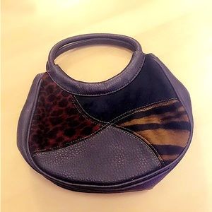 Leather bag with velvet animal print